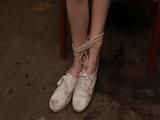 Mia in Attic Chair and white dirty sneakers