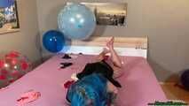 nail2pop big balloons on bed