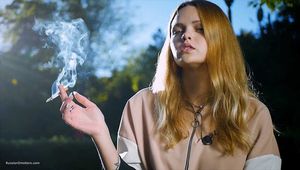 Smoking outside on a sunny day with a lot of smoke