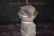 Sexy Sandra being tied and gagged overhead with ropes and a clothgag hodded wearing a sexy rainwear combination (Pics)