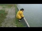Being with Enni sitting at a lake wearing sexy shiny nylon rainwear (Video)