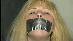 SEXY TRACY CHAIR TIED, BALL-GAGGED & BEING HELD HOSTAGE (D27-11)