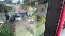 Rachel Adams bound and gagged by an Intruder in shiny Rainwear