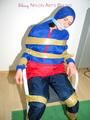 Katharina tied by using tape, gagged and hooded on a chair wearing sexy red/blue rainwear (Pics)