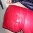 Jill wearing a sexy red shiny nylon shorts and a black rain jacket in the shower having fun with the water and clothes (Pics)