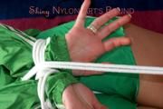 Jill tied and gagged on the floor wearing a hot green shiny nylon shorts and a rain jacket (Pics)
