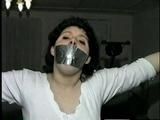 BALL-GAGGED, & TIED BETWEEN  2 PILLARS DAMSEL (D16-12)