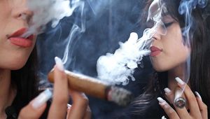 Beautiful Woman Smoking a Cigar