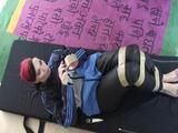 Jill ties and gagges herself in a shiny nylon rainsuit with tape (Video)
