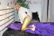 Pia wearing a very hot golden shiny nylon rain pants and a white extraordinary rain jacket blazer posing for you in bed (Pics)