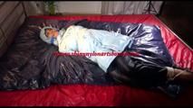 Lulu tied and gagged on a bed wearing a sexy blue shiny nylon rainpants and a iceblue PAMY downjacket (Video)