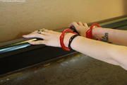 Devin: Goth Girl in red Cuffs  