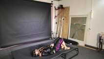 Lana handcuffed and gagged wearing a shiny nylon Windbreaker