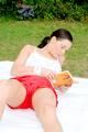 Enni having a good time outdoor wearing sexy shiny nylon shorts and a top posing for the camera (Pics)