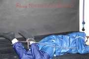 Lucy tied with cuffs overhead and gagged with a clothgag wearing sexy blue rain pants and a raincoat (Pics)
