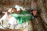 Leonie tied and gagged on a sofa wearing a white shiny nylon shorts and a green rain jacket (Pics)