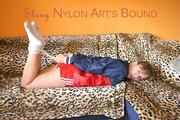 Beautiful archive girl tied and gagged wearing an wonderful red shiny nylon shorts and a shiny red rain jacket (Pics)