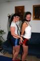 Petra tied and gagged by Jill in shiny shorts