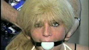 GREEN EYED, BLOND BOMBSHELL, CROTCH ROPED & BALL-GAGGED (D20-14)