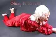 Blonde archive girl posing in a studio wearing a sexy red AGU rainwear combination (Pics)