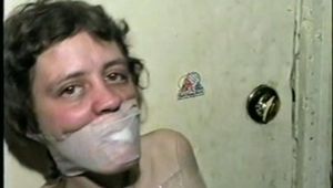 TINY TINA NAKED & MUMMY WRAPPED WITH PLASTIC WRAP & BLACK TAPE (D28-12)