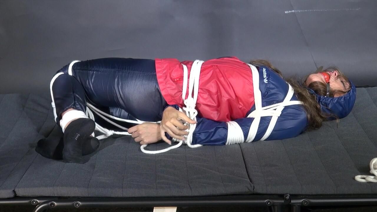 Marie Bound And Gagged In Shiny Nylon Rainwear