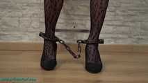 Cuffed to the ladder with legcuffs