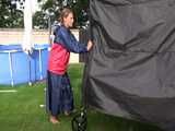 Watch Sandra enjoying the Sun in her shiny nylon Rainjacket and Rainskirt