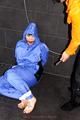 Jill bound and gagged by Simone in shiny nylon rainwear