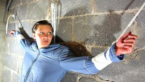 Alina tied and gagged in a skisuit
