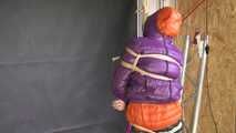 Rachel Adams bound, gagged and double hooded in shiny downjackets