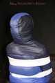 Sexy Mara wearing a black rain pants and a blue/black down jacket being tied, gagged and hooded with tape and clothgag (Pics)