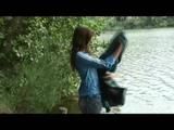 Alina walking on a lake wearing sexy shiny nylon shorts under her jeans and a down jacket (Video)