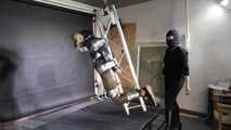 Rachel Adams bound, gagged and suspended in shiny nylon Down