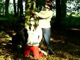 Two girls cuffed to a tree 2/2