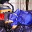 Sonja tied and gagged on bed with cuffs wearing a sexy lightblue rain pants and a purple down jacket (Pics)