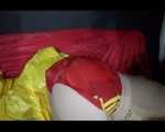 Sexy Mara wearing only a red shiny nylon shorts lolling and posing on the sofa (Video)