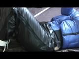03:50 Min. video with Jill tied and gagged in a shiny nylon down jacket