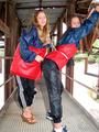 two of our archive girls in shiny nylon rainwear and bondage