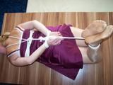 Hogtied on a table 