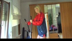 Pia wearing a sexy blue shiny nylon shorts and an oldschool rain jacket during her workout on the crosstrainer (Video)