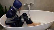 Myxxxy surprised by an Intruder in her Bathroom finally bound and gagged in Rainwear