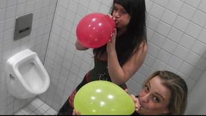 Two girls at the mens toilet