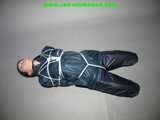 Get 101 Pictures with Lupi tied and gagged in shiny nylon rainwear from 2005-2008!