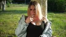 Nastya is smoking in the park