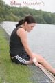 Enni outdoor wearing a sexy black shiny nylon shorts and a black top (Pics)