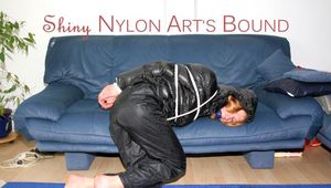 Katharina tied, gagged and hooded wearing a shiny nylon rain pants and a shiny nylon downjacket (Pics)