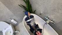 Myxxxy surprised by an Intruder in her Bathroom finally bound and gagged in Rainwear