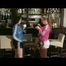 Jenny and a friend of her being in a bar both wearing sexy shiny nylon shorts and rain jackets (Video)