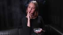 Dasha is smoking in the studio